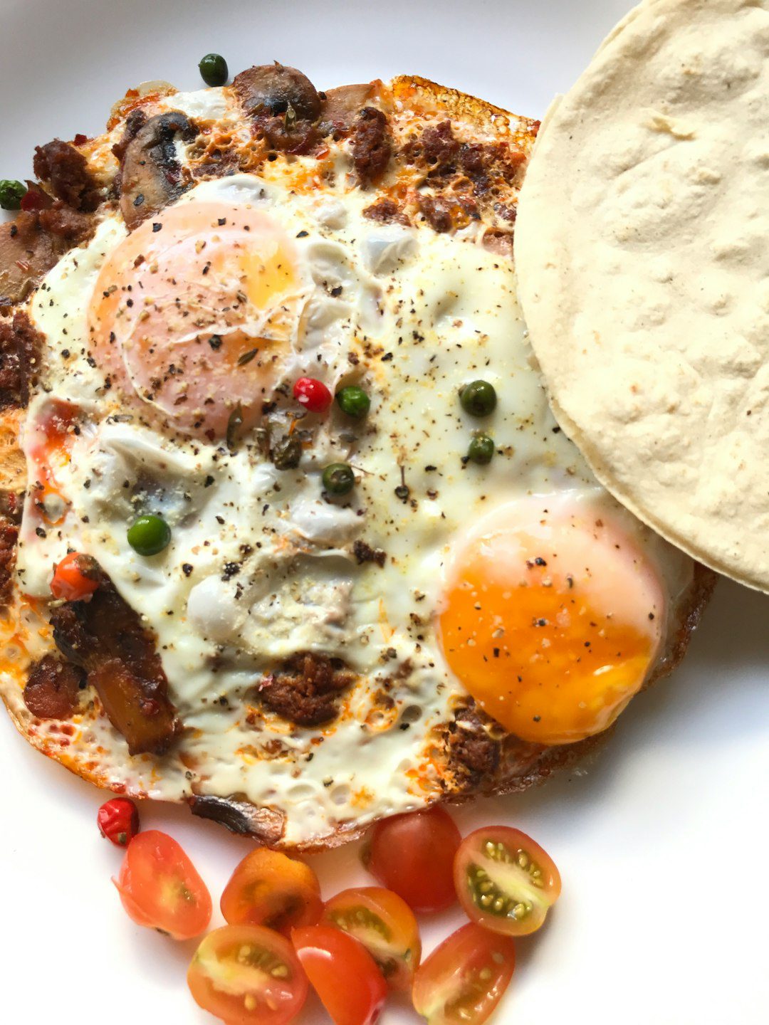 A plate of the best huevos rancheros with salsa and eggs